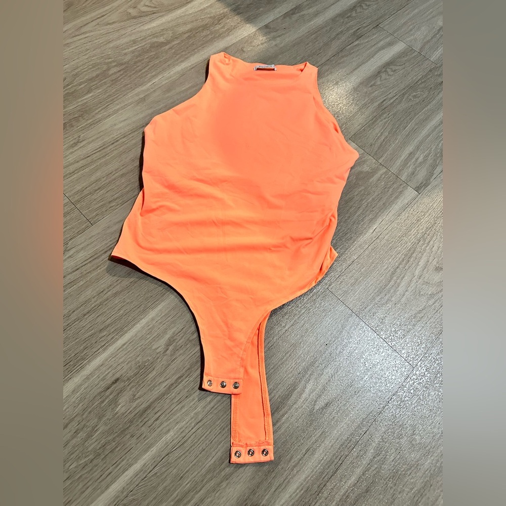 Orange body suit